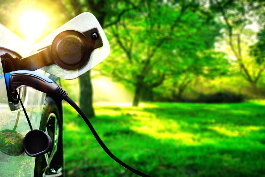 EV charging station for electric car in concept of green energy and eco power produced from sustainable source to supply to charger station in order to reduce CO2 emission .